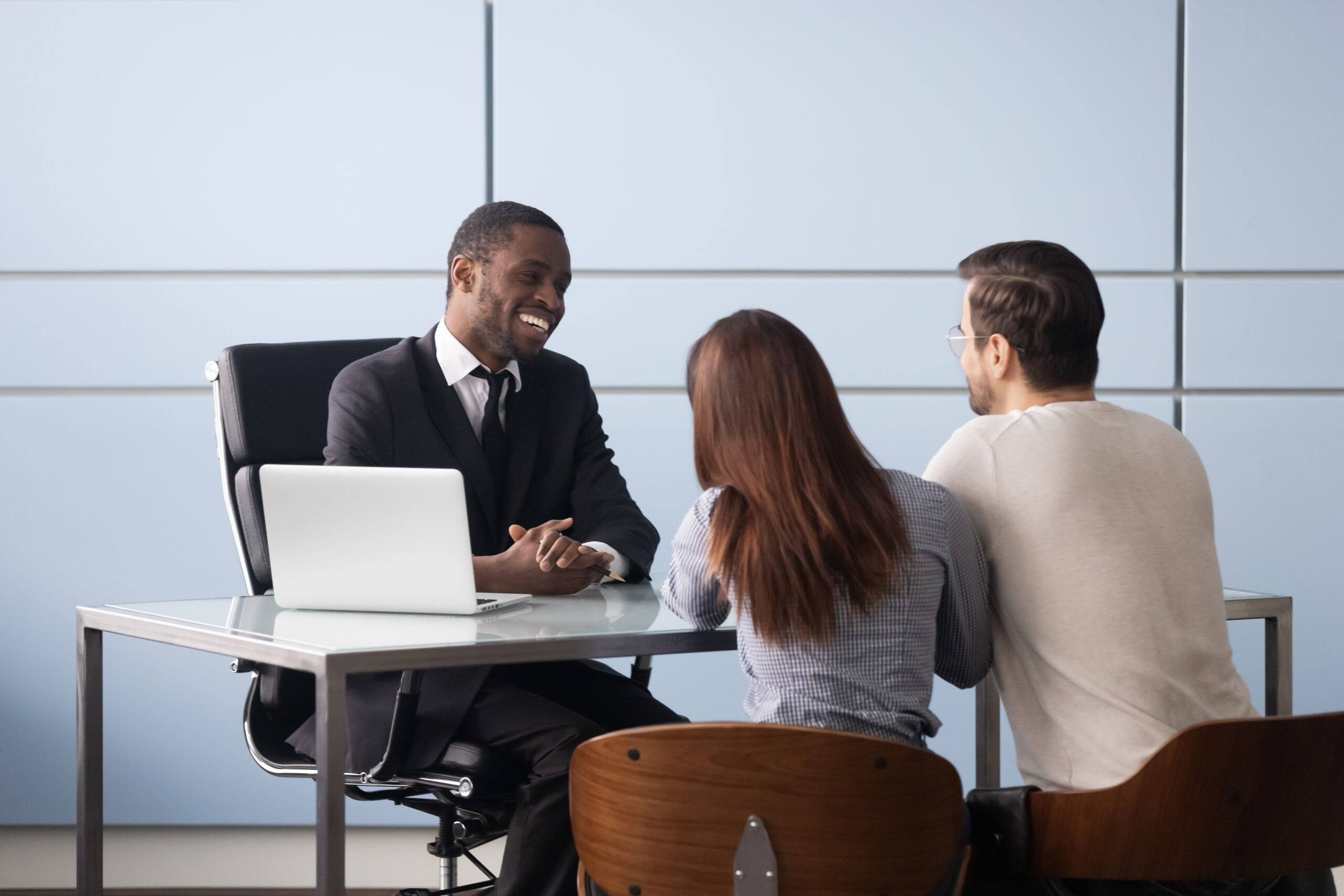 A sales representative having a meeting with his clients.