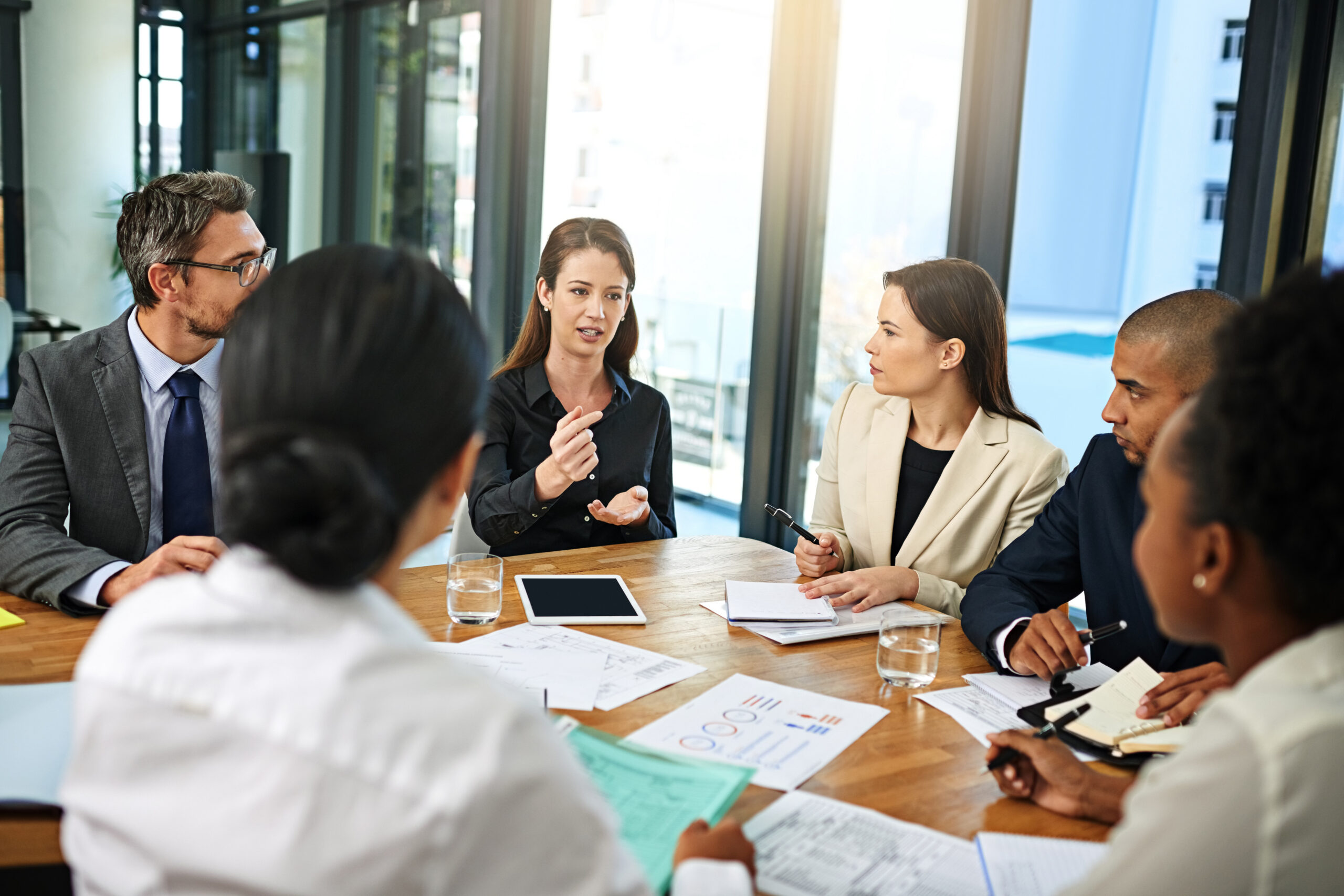 A business development consulting team working together.